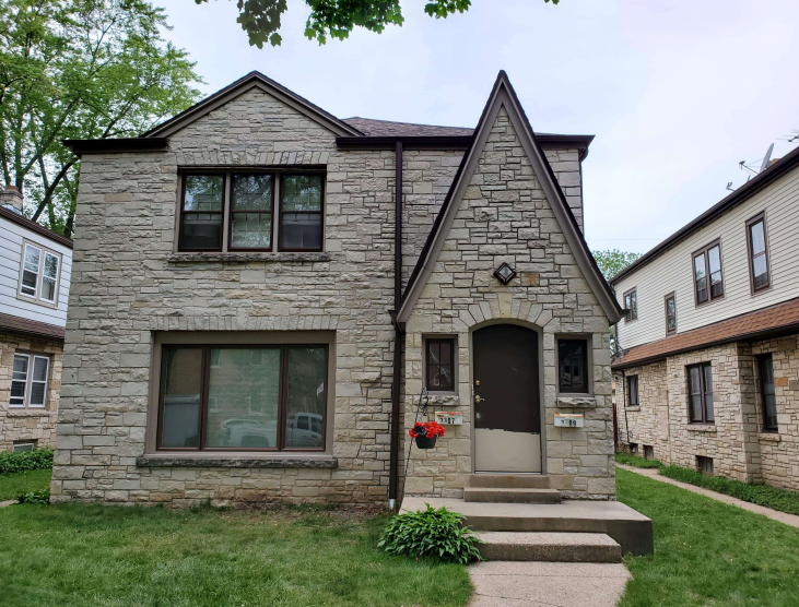 Stone Milwaukee home with Royal Brown gutters